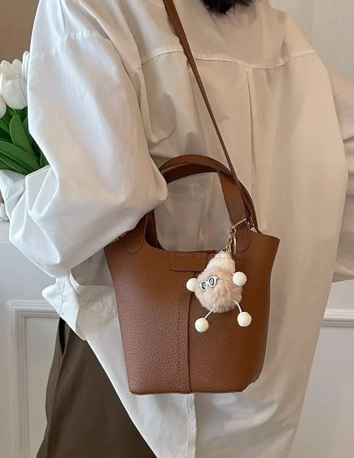 Small Litchi Embossed Bucket Bag With Pom Pom Bag Charm   536700