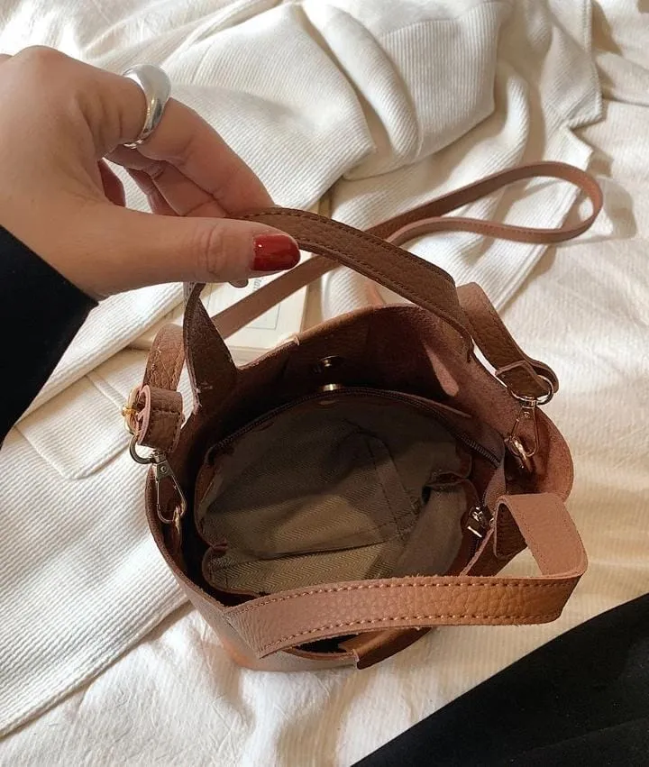 Small Litchi Embossed Bucket Bag With Pom Pom Bag Charm   536700