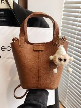 Small Litchi Embossed Bucket Bag With Pom Pom Bag Charm   536700